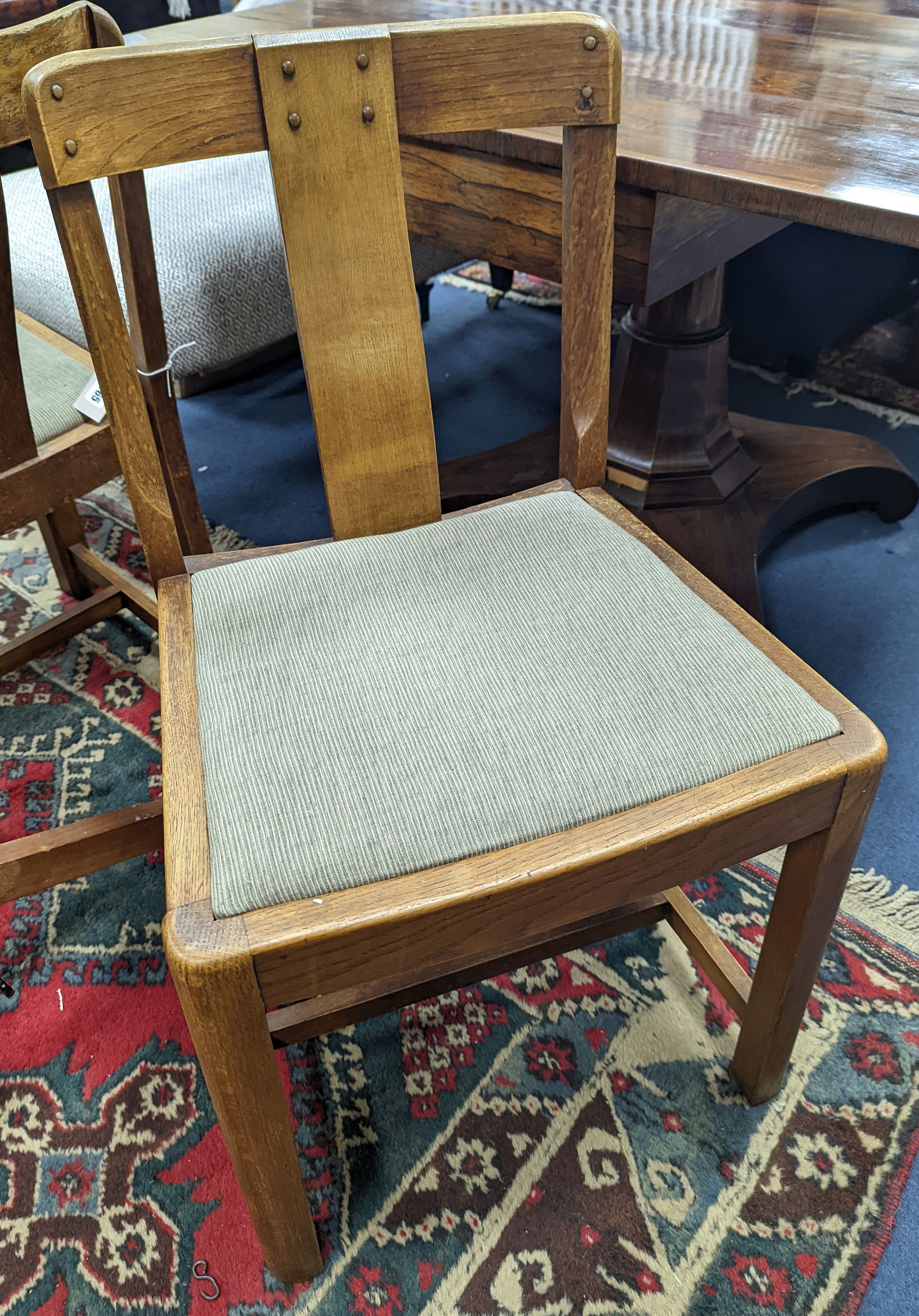 A pair of Arts and Crafts oak side chairs, outer Hebrides